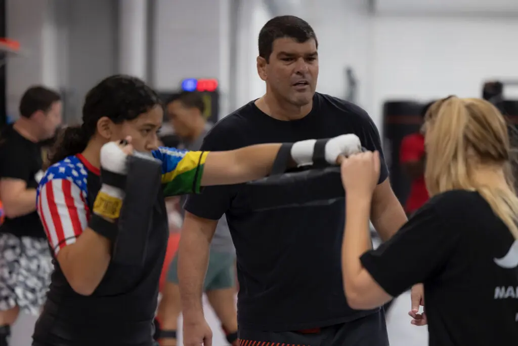 Women drilling striking combinations during a cardio kickboxing class at ATT Winter Garden