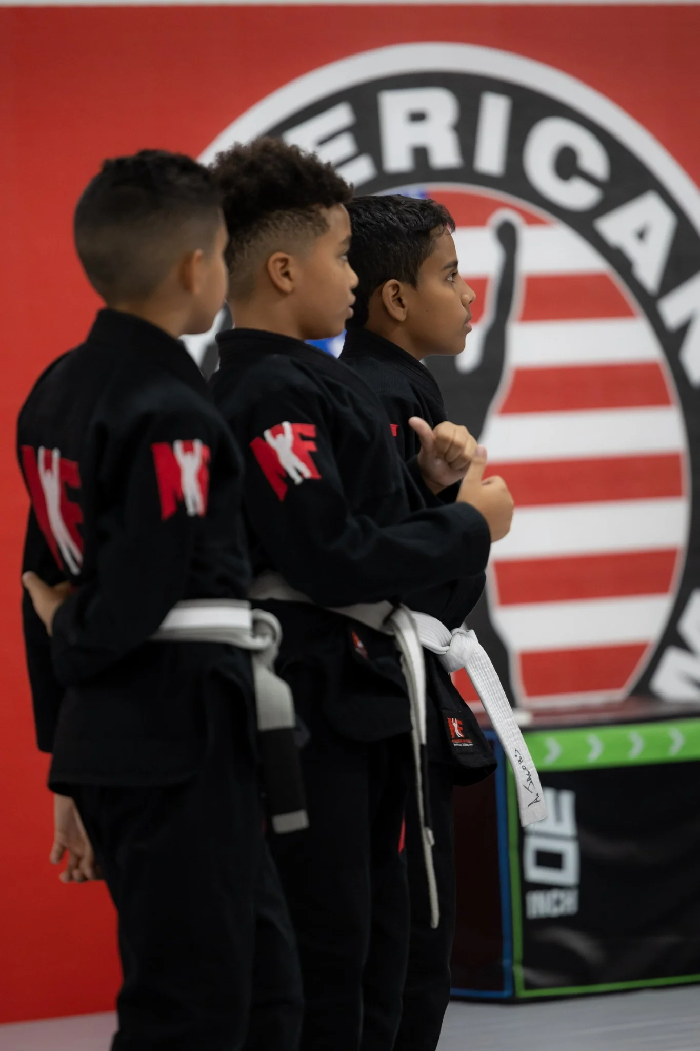 Kids in gis lined up before class at American Top Team Winter Garden